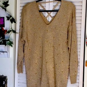 - Sexy gold beaded sweater.